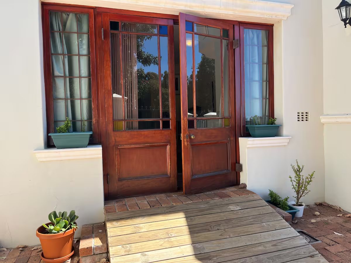 The studio exterior on a leafy Vredehoek street